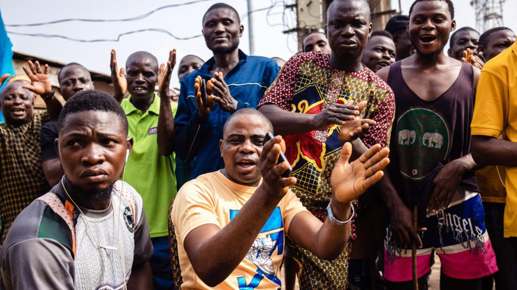 People cheer after the Independent National Electoral Commission (Inec) officials announced results in their polling station - Nigeria