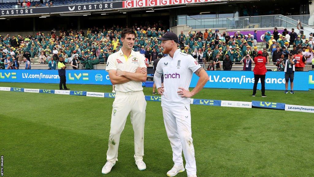 Ben Stokes chatting to Pat Cummins