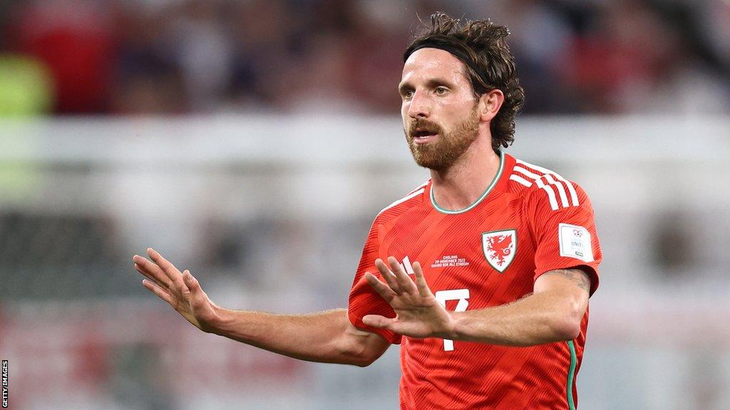 Joe Allen in action for Wales against England at the 2022 World Cup