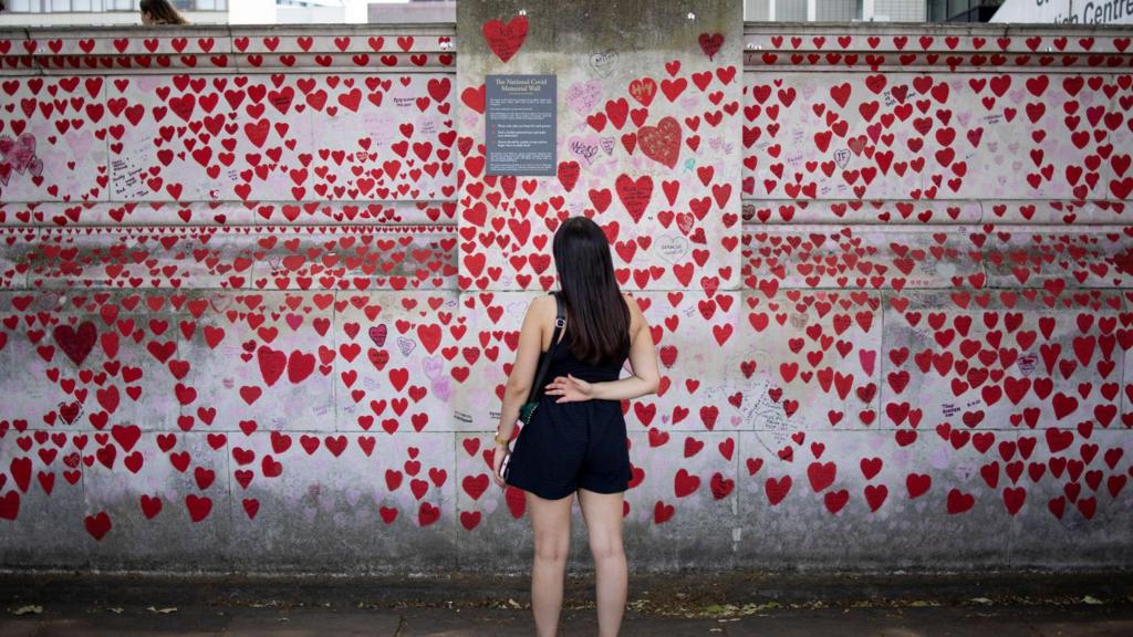 A person visits the National Covid Memorial Wall in London, Britain, 13 June 2023.