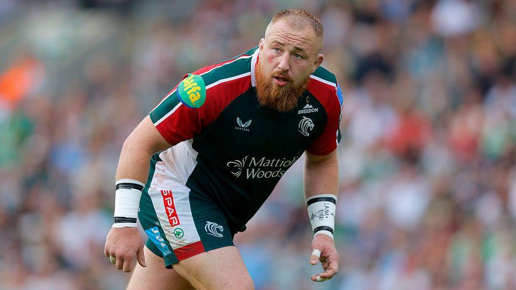 Joe Heyes leans forward and looks to his right during Leicester's Prem match with Northampton.