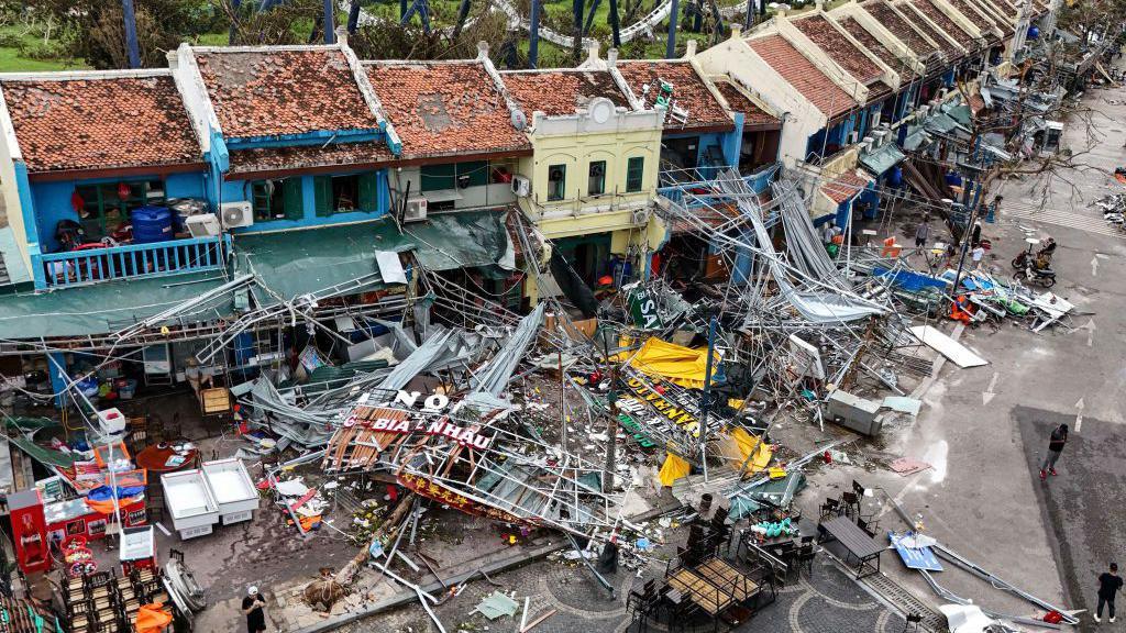 Damaged buildings and debris on a street after super typhoon Yagi hit Ha Long, in Quang Ninh province