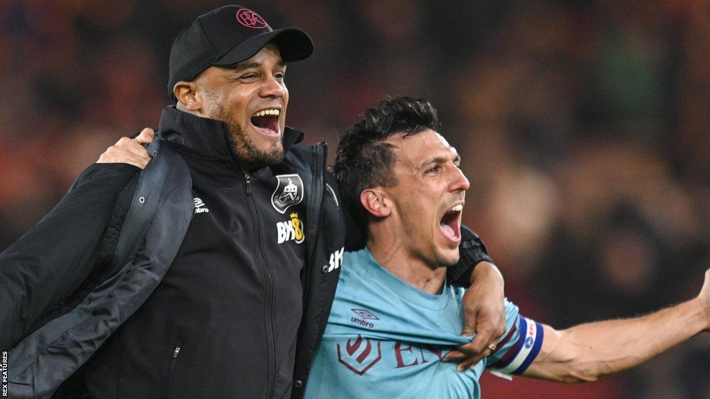 Vincent Kompany and Burnley club captain Jack Cork celebrate