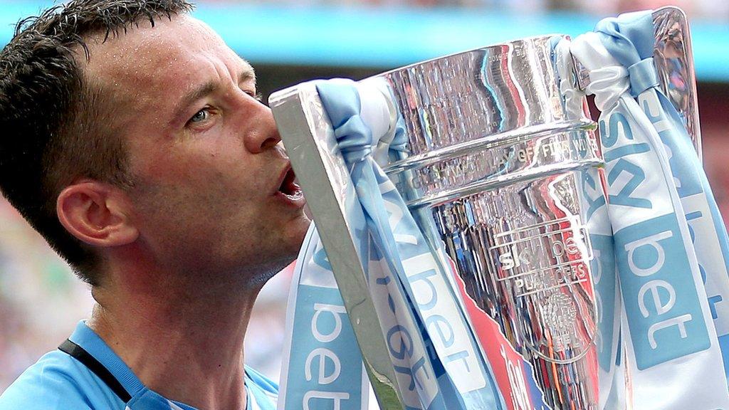 Coventry captain Michael Doyle with the League Two play-off trophy