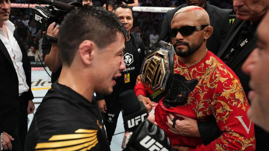 Deiveson Figueiredo and Brandon Moreno together in the octagon following Moreno's win over Kai Kara-France