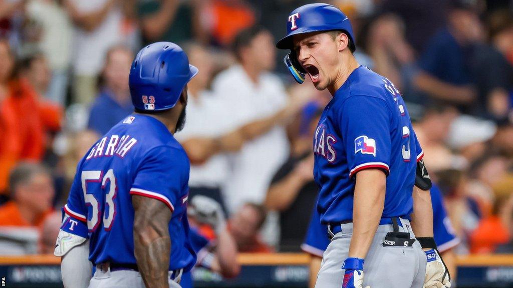 Adolis Garcia and Corey Seager celebrate a home run for the Texas Rangers