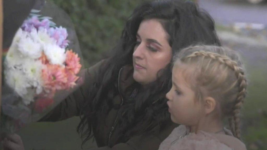 mother and daughter with flowers