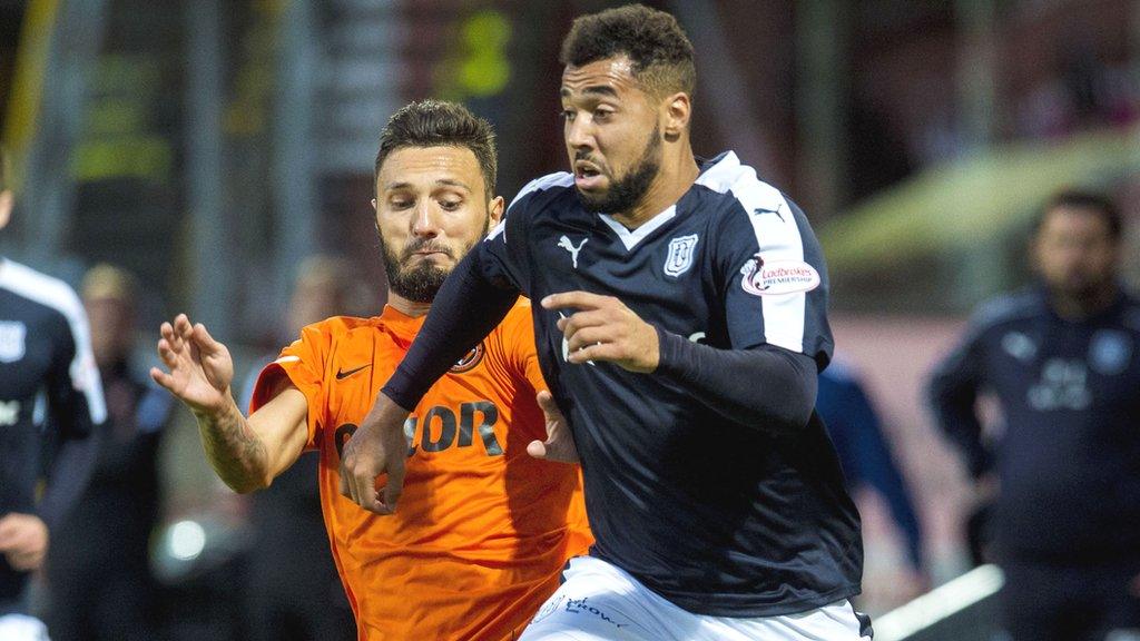 Kane Hemmings receives a challenge from Dundee United's Darko Bodul