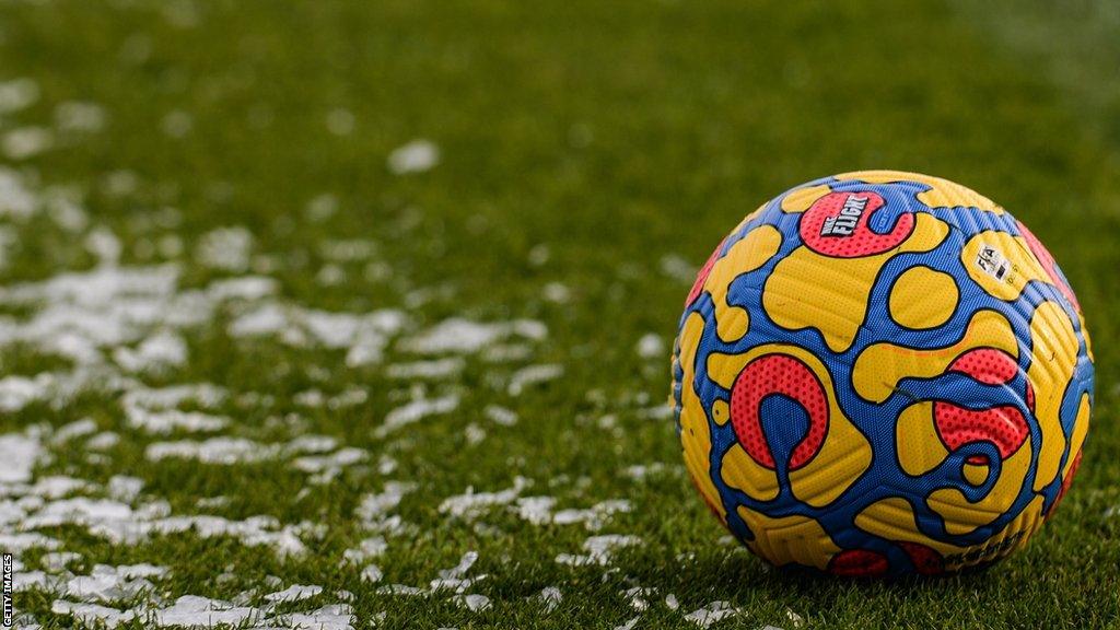 Football on frozen pitch