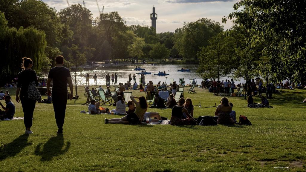 LONDON, ENGLAND - JUNE 05: Young people socialising in Regents Park early evening on June 05, 2021 in London, England.