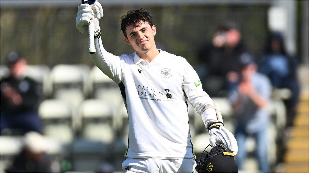 Gloucestershire's Tom Price celebrates his maiden first-class hundred