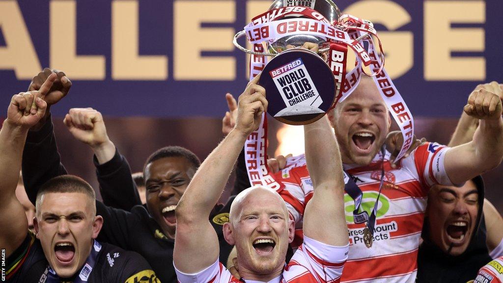 Liam Farrell of Wigan Warriors lift the trophy following victory during the Betfred Super League Final match between Wigan Warriors v Catalans Dragons at DW Stadium on February 24, 2024 in Wigan, England