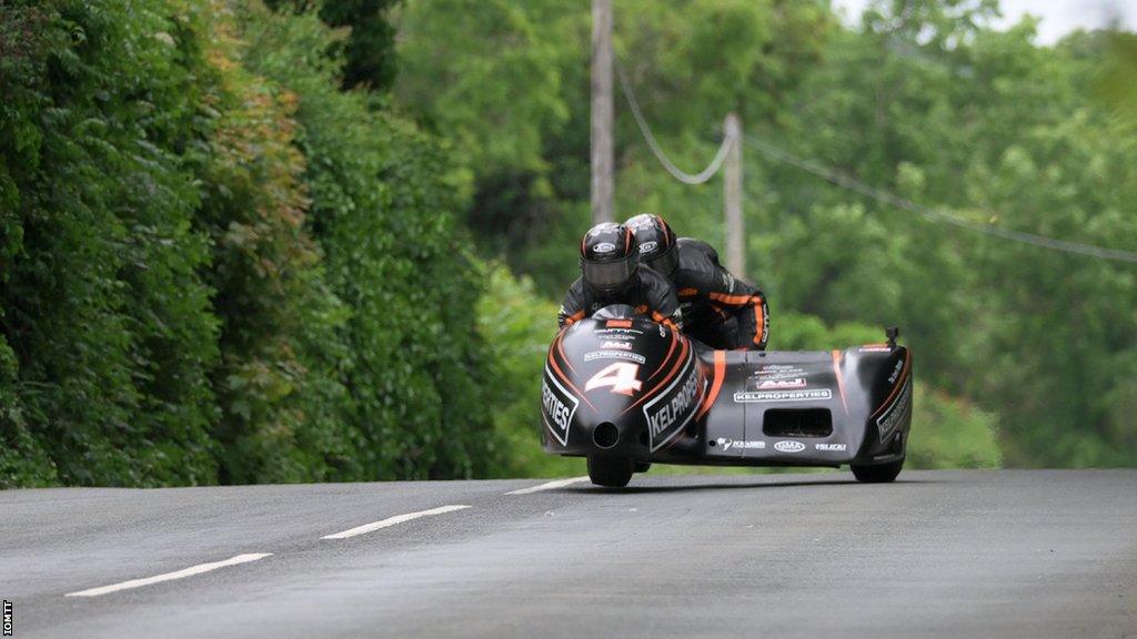 Dave Molyneux and Dan Sayle racing their sidecar at the 2023 Isle of Man TT