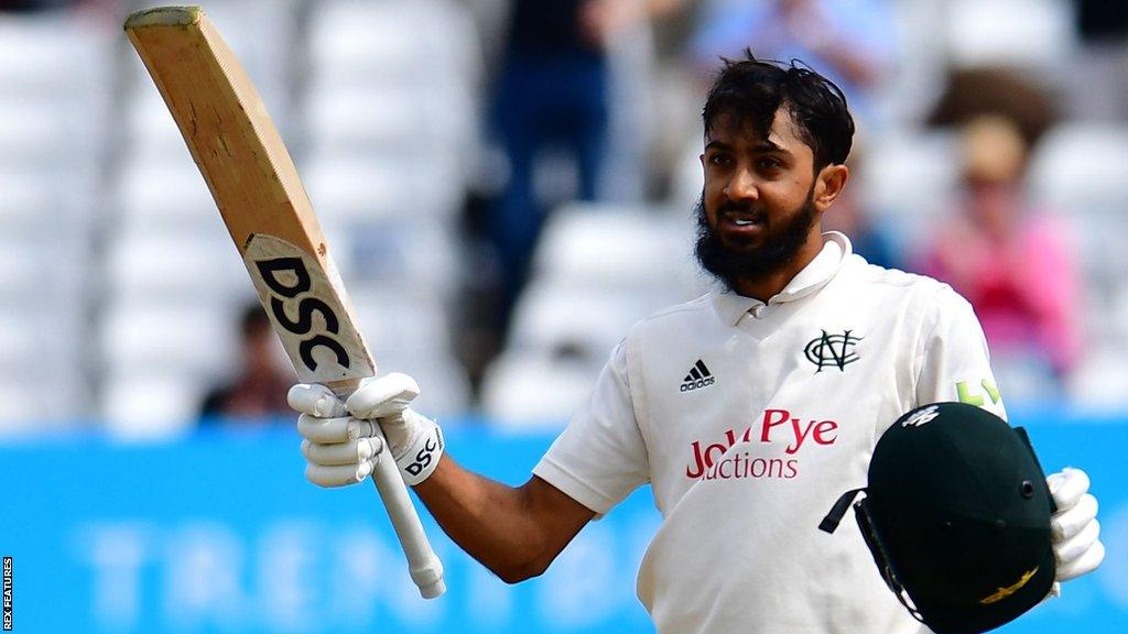 Haseeb Hameed holds his bat up after scoring a century for Nottinghamshire