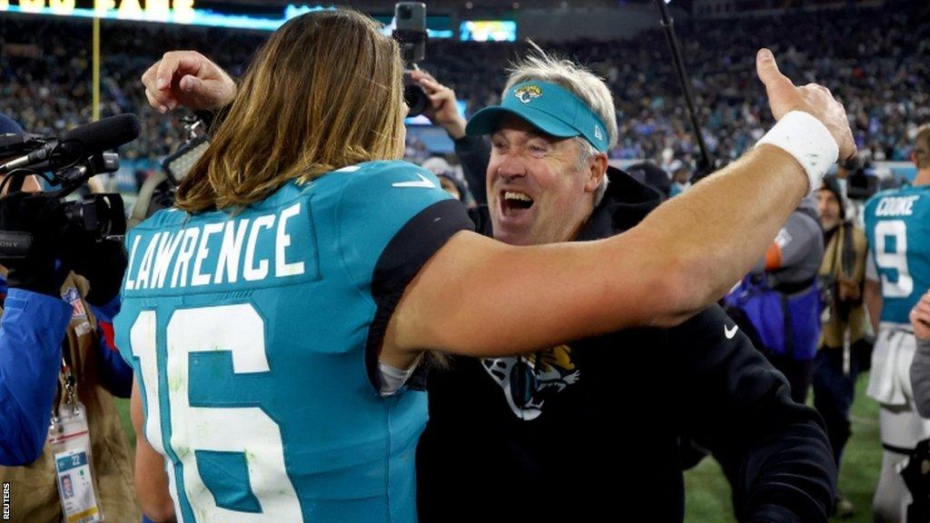 Trevor Lawrence celebrates with Doug Pederson