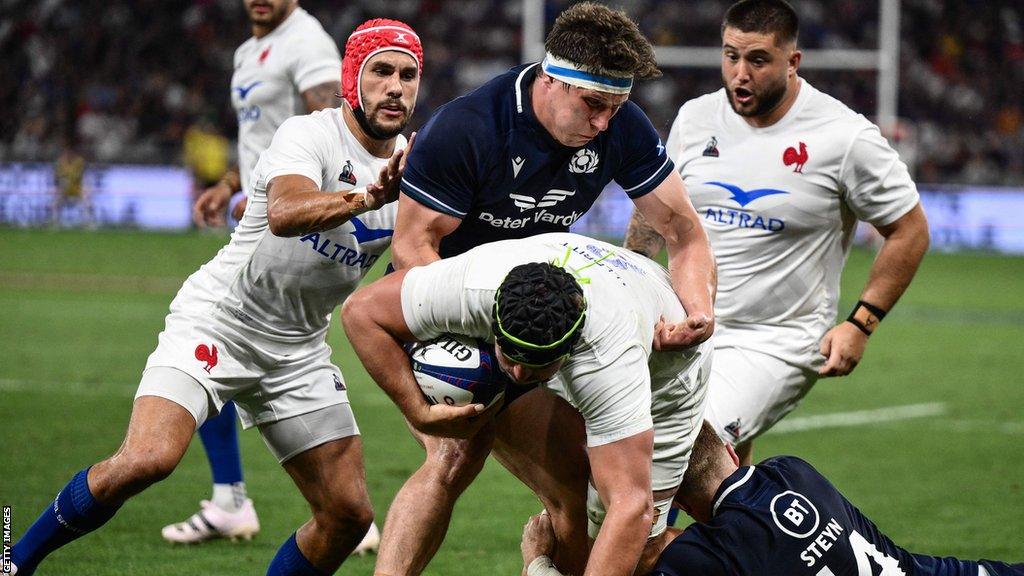 Scotland's Rory Darge tackles France's Gregory Alldritt