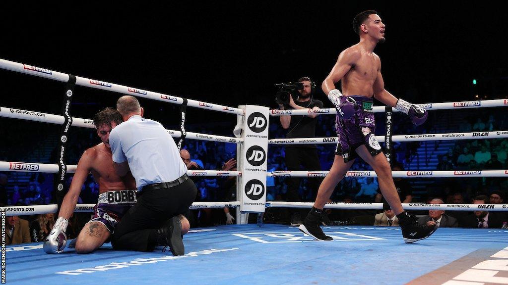 Diego Pacheco celebrates as referee stops the contest with Jack Cullen on the floor