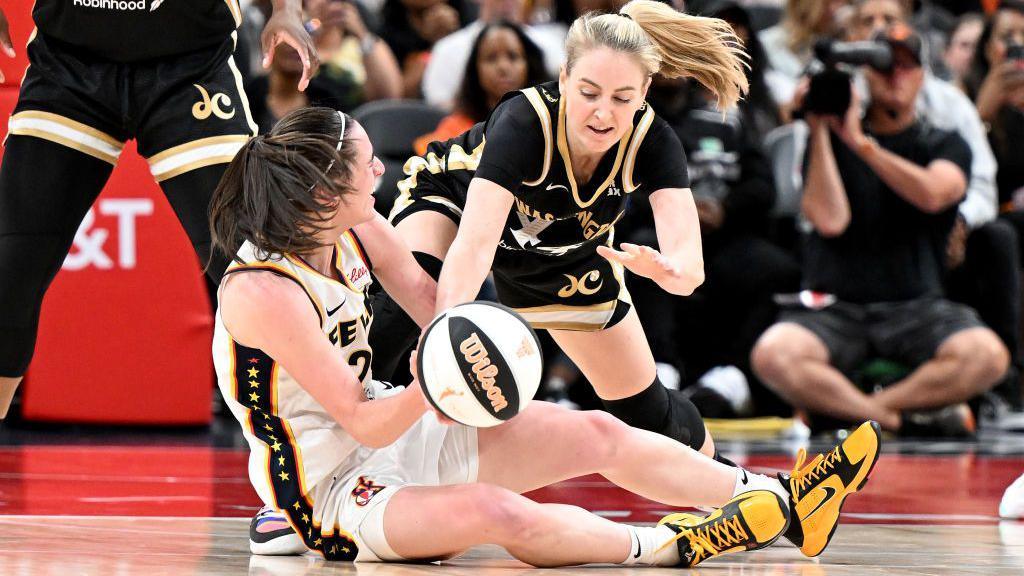 Caitlin Clark fights for the ball in the fourth quarter during the Indiana Fever's game against the Washington Mystics on Friday.