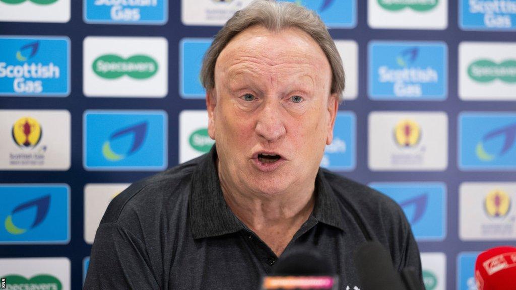 Aberdeen manager Neil Warnock speaks at a media conference