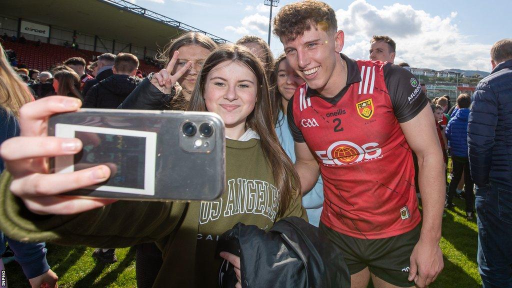 Down skipper Pierce Laverty with fans after the team's victory over Donegal