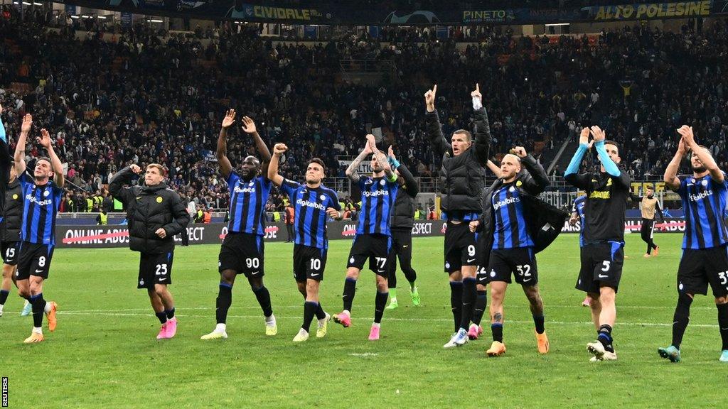 Inter Milan's players celebrate reaching the semi-finals of the Champions League