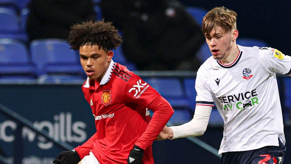 Shola Shoretire (left) played against Bolton Wanderers for Manchester United in the Papa John's Trophy in December