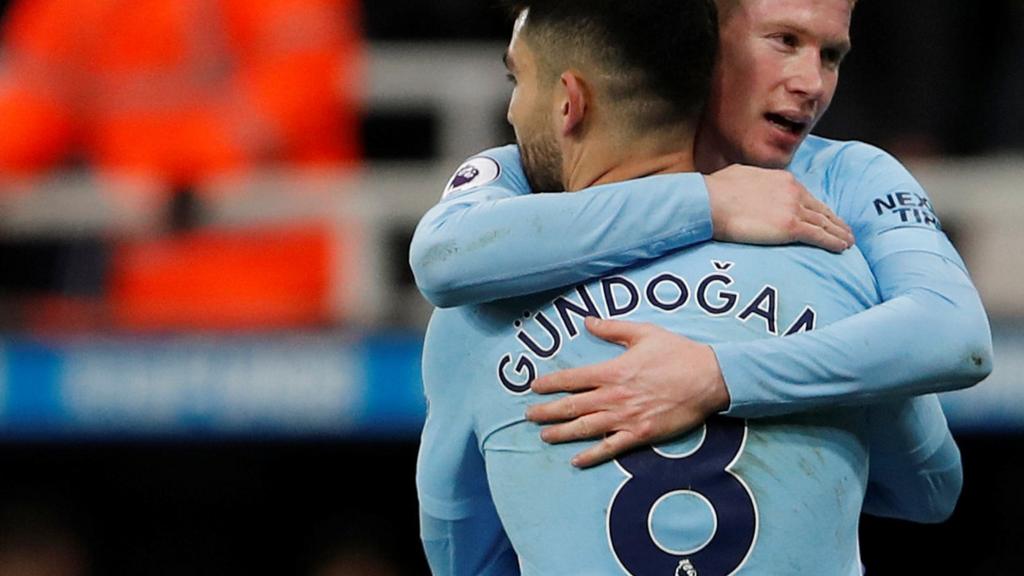 Kevin de Bruyne and Ilkay Gundogan embrace at full-time