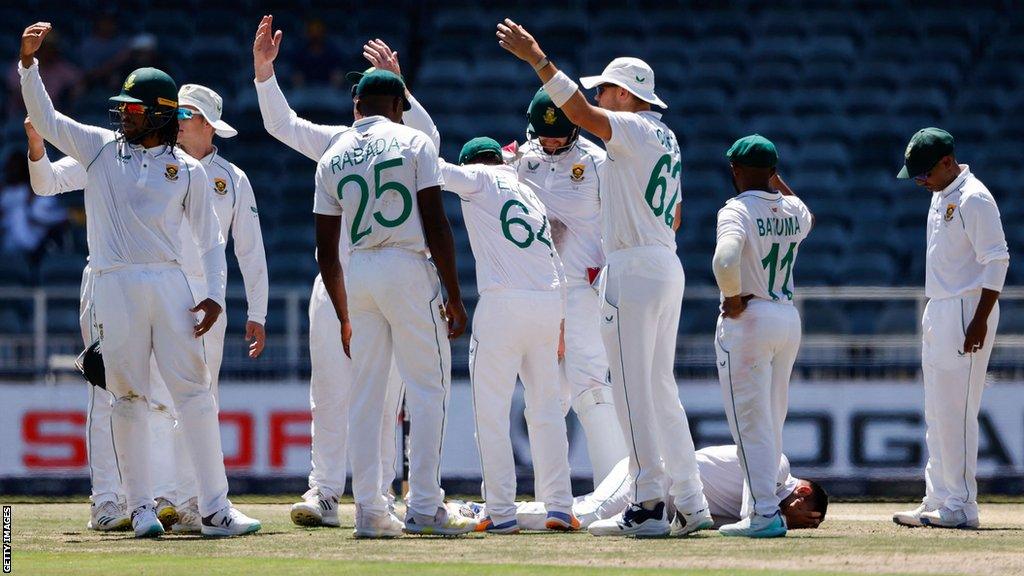 Keshav Maharaj surrounded by his South Africa team-mates after his "freak" injury