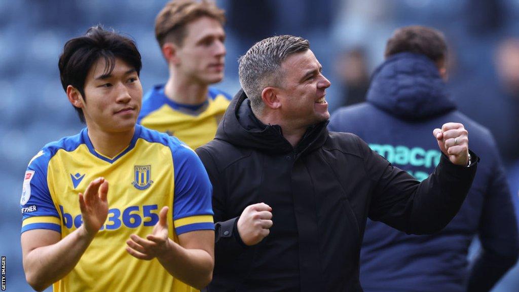 Stoke City boss Steven Schumacher celebrates the Potters' victory at Preston