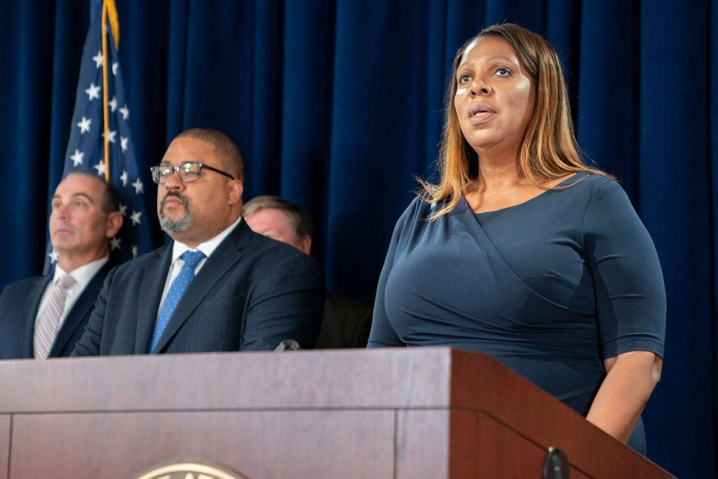 New York State Attorney General Letitia James (R) speaks as Manhattan District Attorney Alvin Bragg looks on