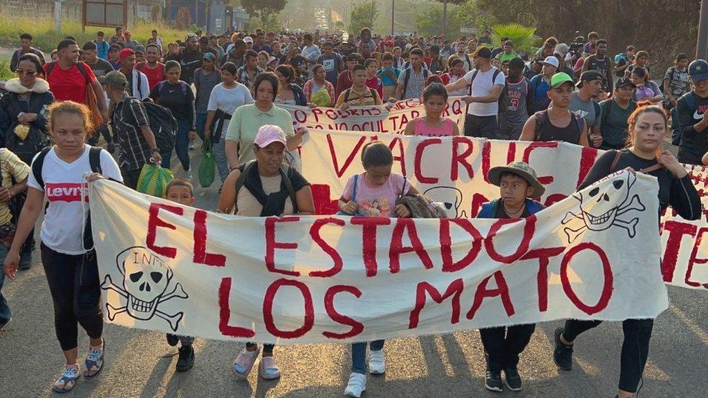 Migrants from Central and South America take part in a caravan attempting to reach the Mexico-US border, while carrying out a viacrucis to protest for the death of 40 migrants in a fire at a detention center in the northern city of Juarez, in Tapachula, Chiapas state, southern Mexico, on April 23, 2023.