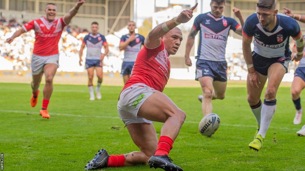 Tyson Frizell celebrates scoring against England on his Tonga debut