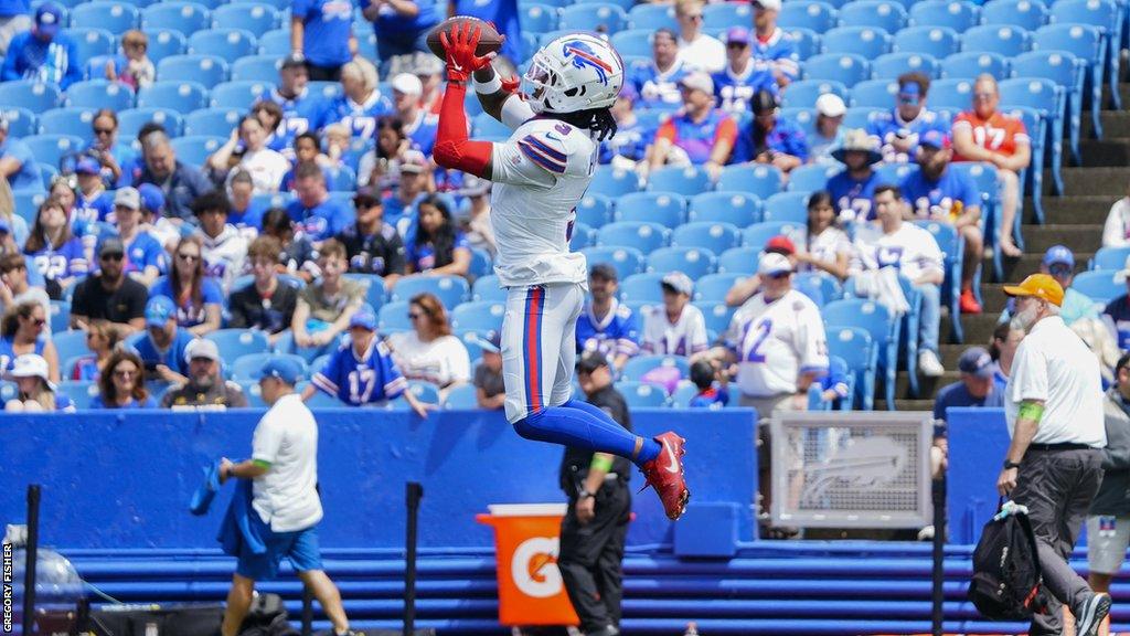 Damar Hamlin catches a ball during pre-game warm-ups