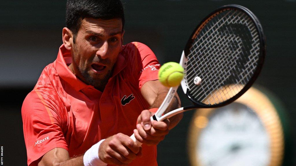 Novak Djokovic makes a forehand