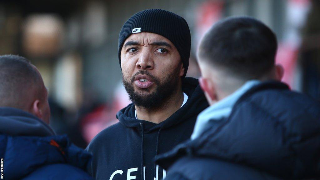 Troy Deeney talking before a match