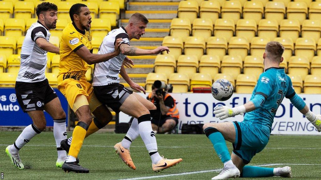 Cristian Montano (second left) scores for Livingston