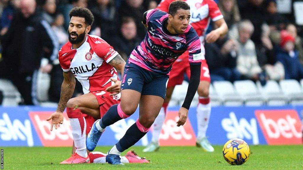 Ethan Erhahon (centre) has made 54 appearances for Lincoln since joining them just over a year ago