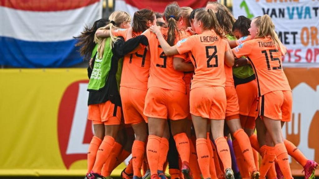 Team Netherlands celebrate scoring against Germany in the Group A match