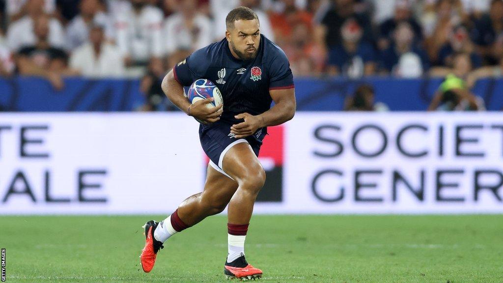 Ollie Lawrence runs with the ball during a World Cup game for England