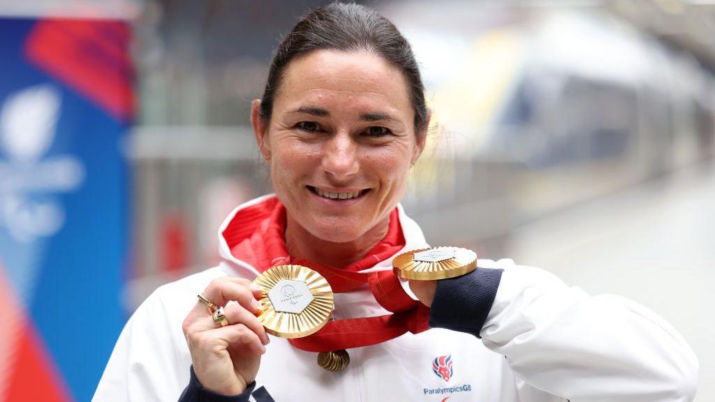 Sarah Storey shows her two Paralympic gold medals from Paris 2024