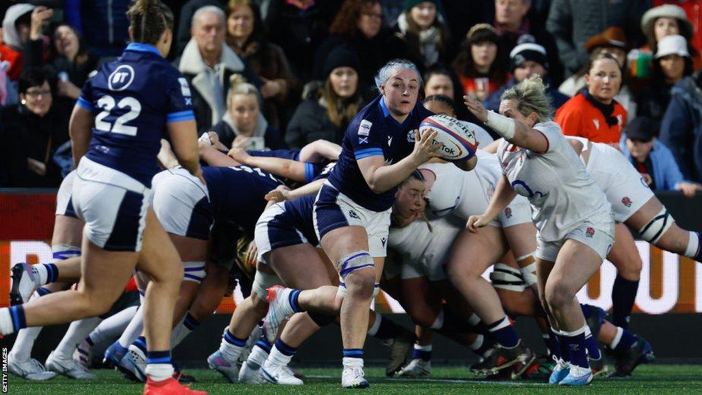 Evie Gallagher carries the ball