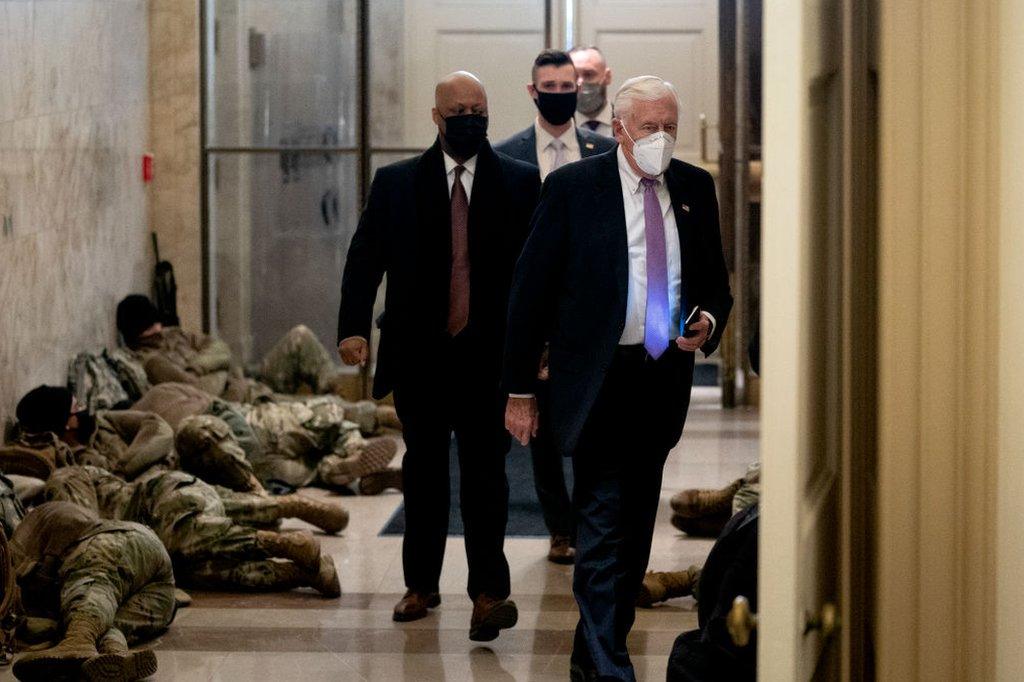 House Majority Leader Steny Hoyer, Democrat of Maryland, walks past members of the National Guard as he arrives at the US Capitol in Washington