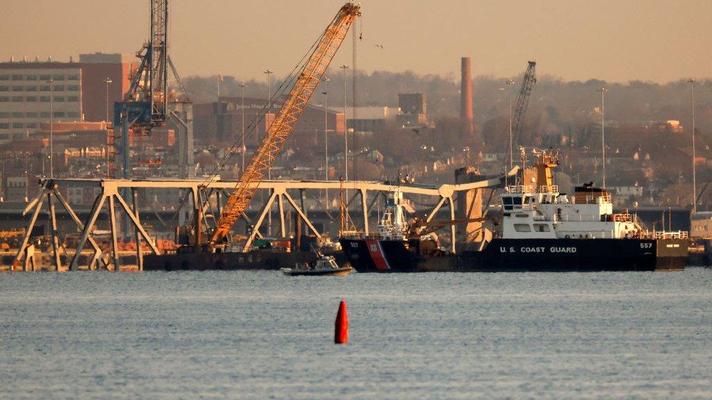 A crane works on the debris of the Francis Scott Key Bridge on March 29, 2024 in Baltimore, Maryland.