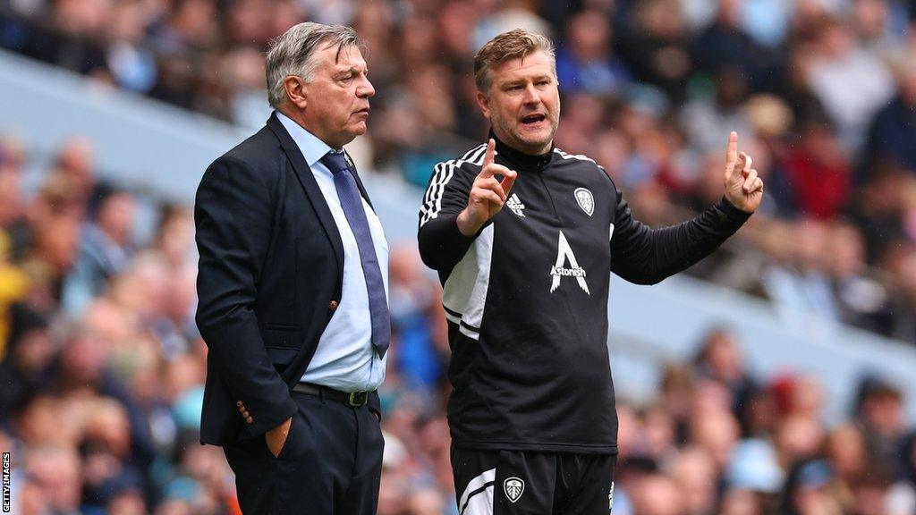 Karl Robinson on touchline alongside Sam Allardyce