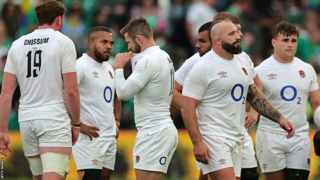 The England players look dejected at the full-time whistle at the Aviva Stadium