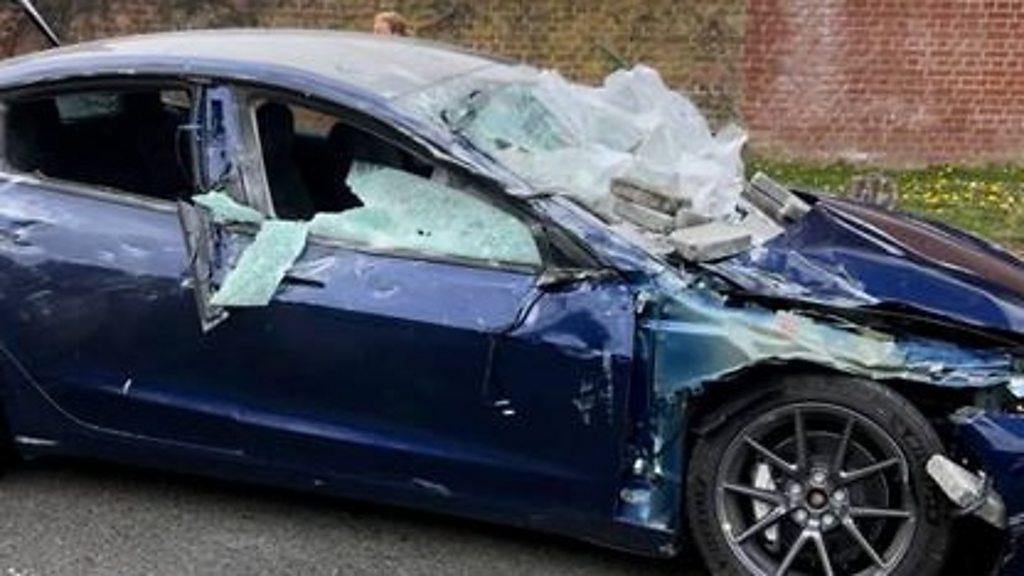 The couple escape almost unscathed as the slabs fell on to the car windscreen, bonnet and roof.