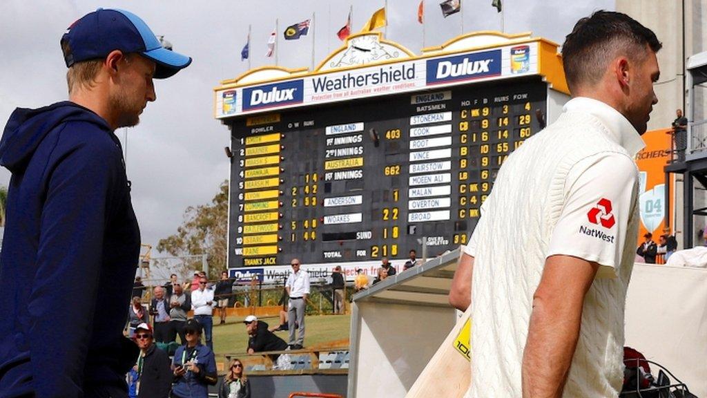 Joe Root and James Anderson walk off