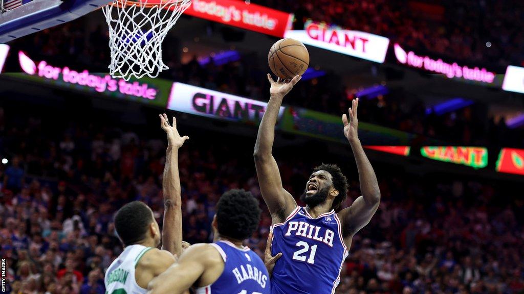 NBA star Joel Embiid, who chose to represent the USA for the Paris Olympic Games, shoots for the Philadelphia 76ers