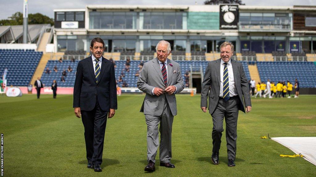 Glamorgan chairman Gareth Williams (L) and chief executive Hugh Morris (R) show King Charles, then the Prince of Wales, around Sophia Gardens in Cardiff during the 2021 summer