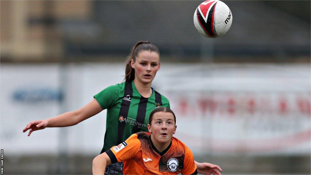 Pontypridd's Megan Saunders controls under pressure from Aberystwyth's Libby Isaac